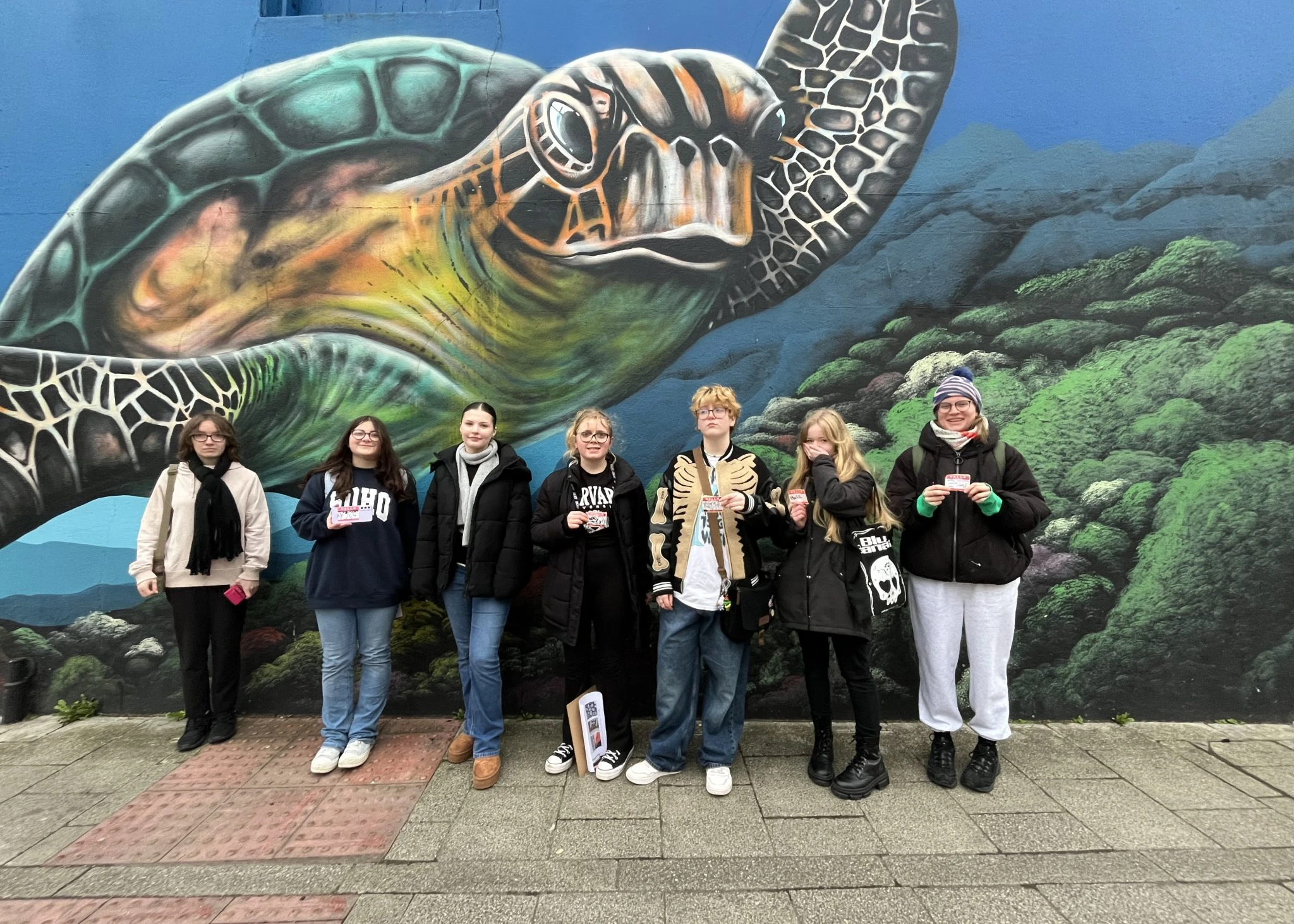 Big Wall art activists in front of a painted wall in Weston-super-Mare town centre.