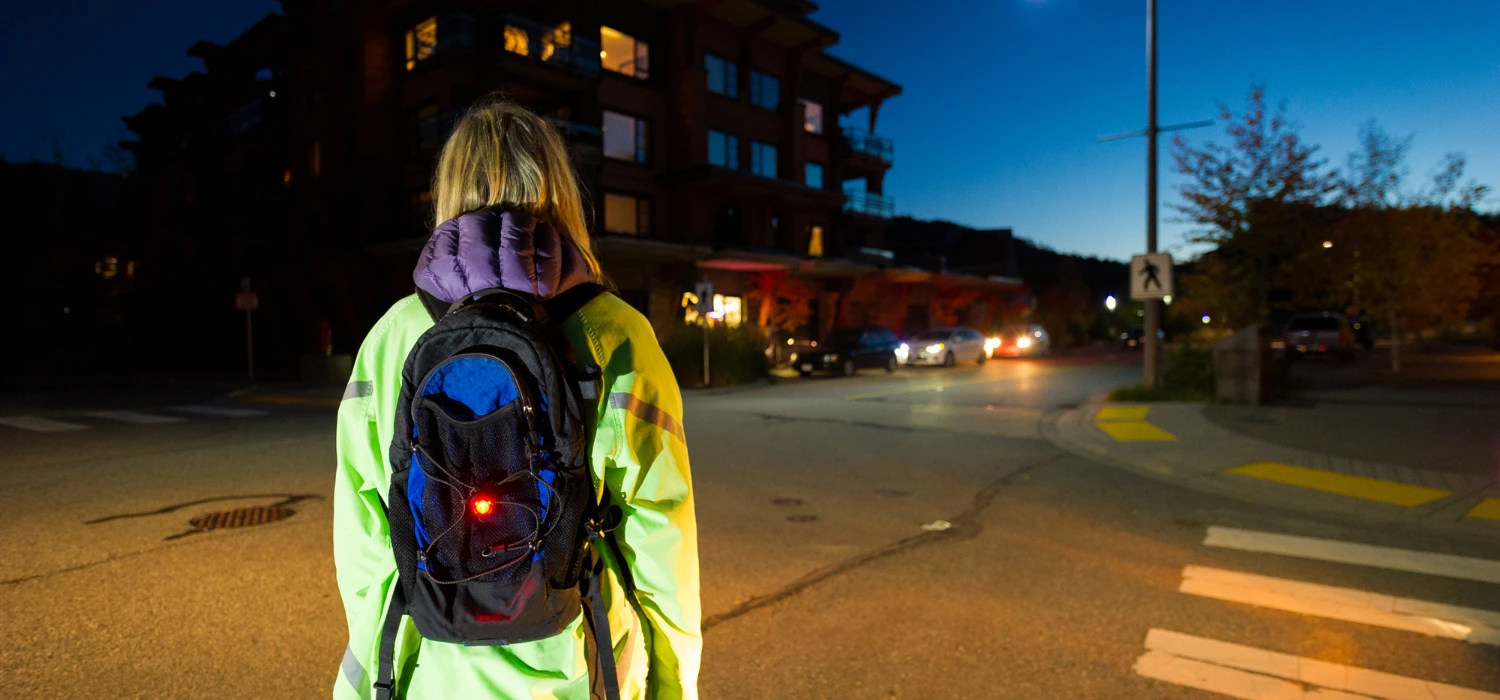 A girl walking down the streets of Worle in the dark.