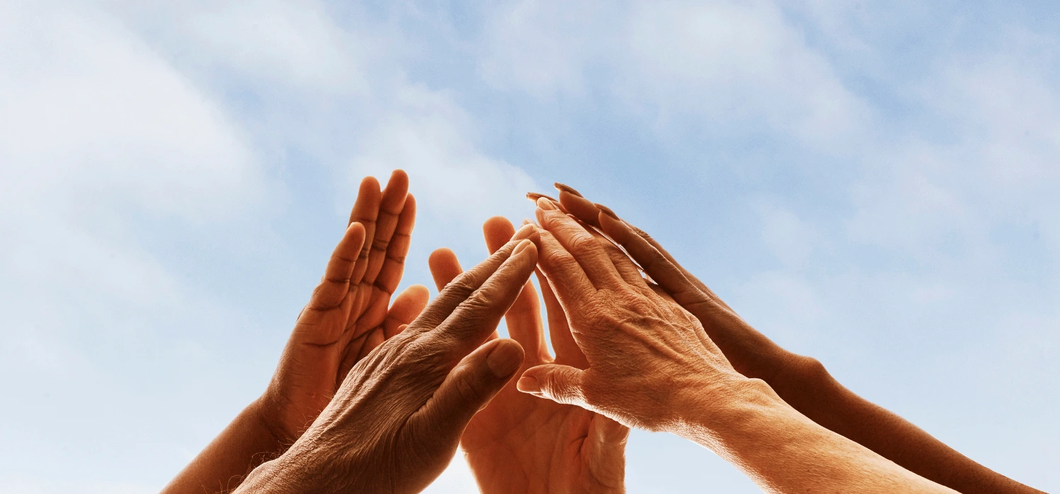 People holding hands together.